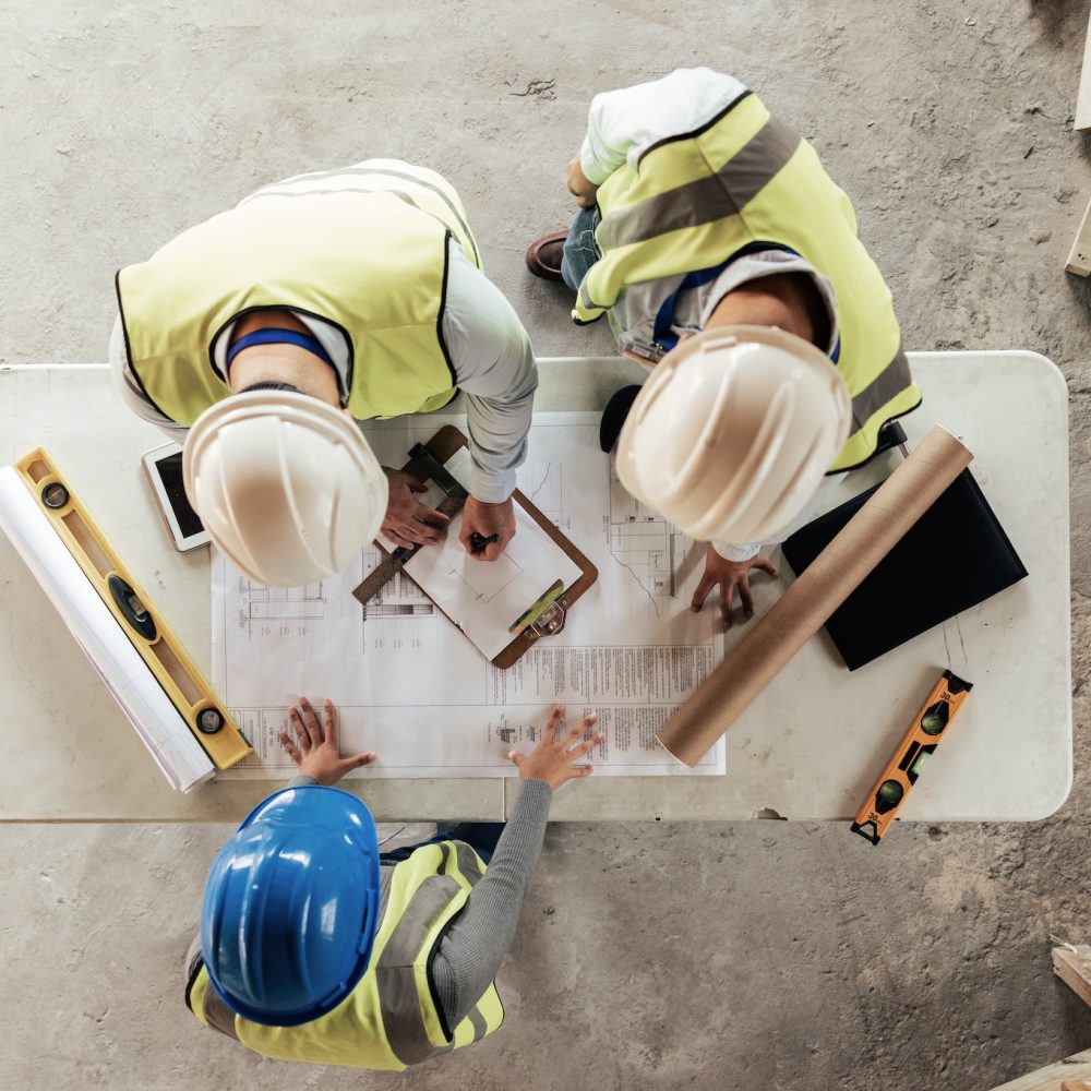 Architect, engineer and teamwork with blueprint from above on a building or contractor project. Bui